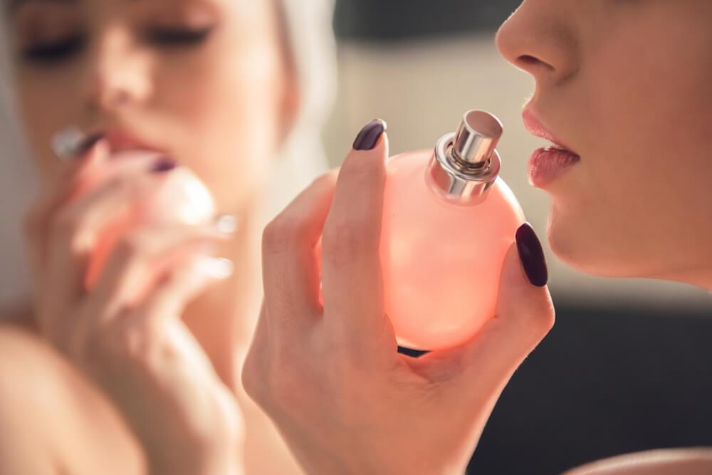 Woman smelling perfume
