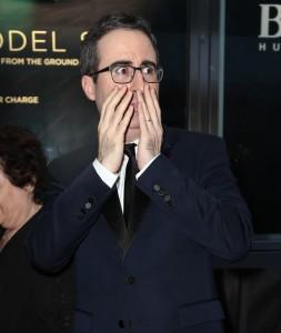 John Oliver making a silly face on the red carpet