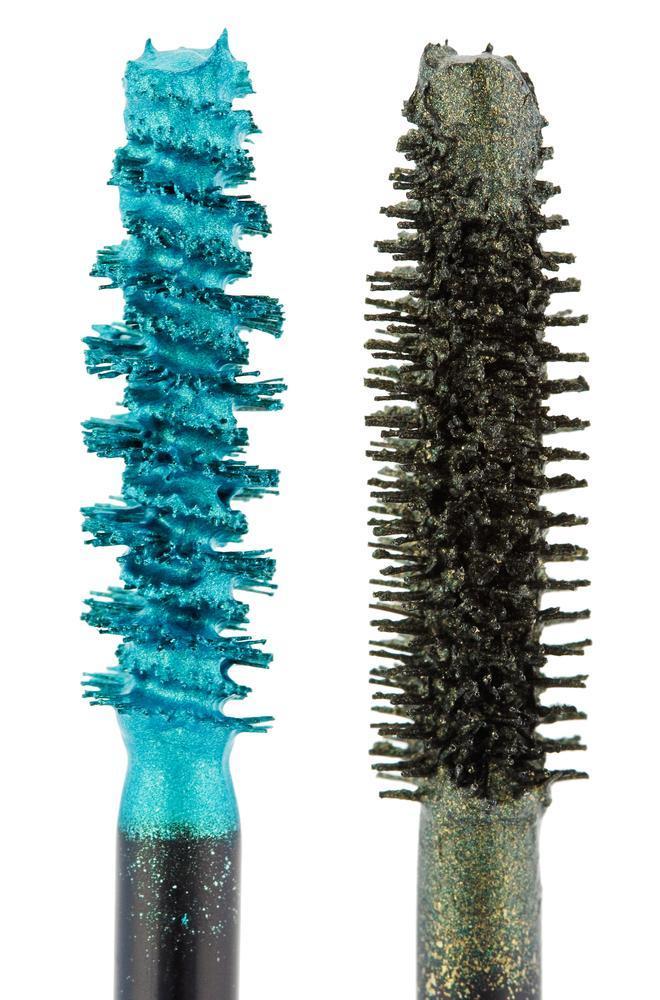 Bright blue and dark green mascara brushes