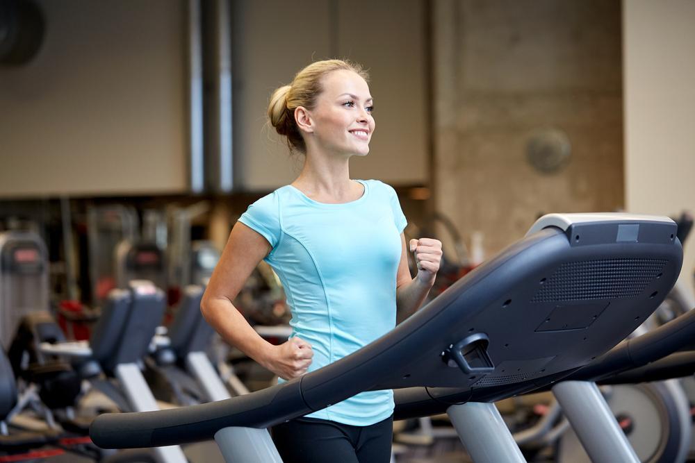 woman running on treadmill