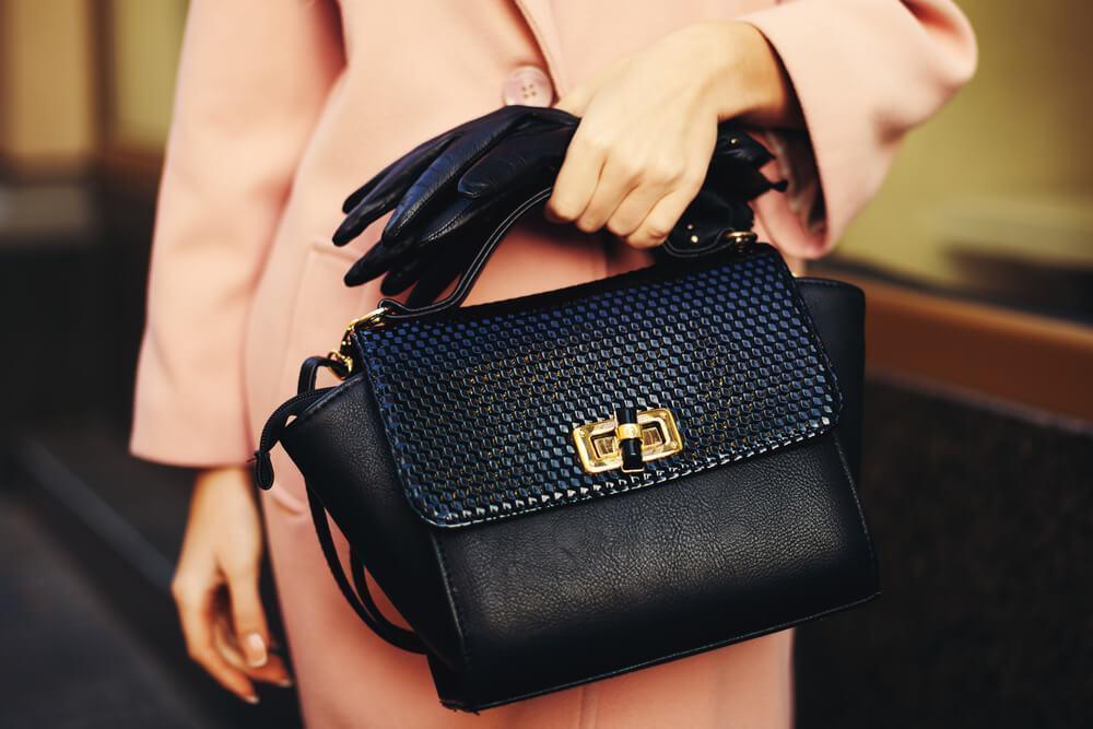black handbag with gold clasp