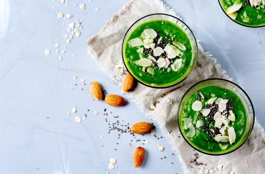 green smoothies with almonds on table cloth