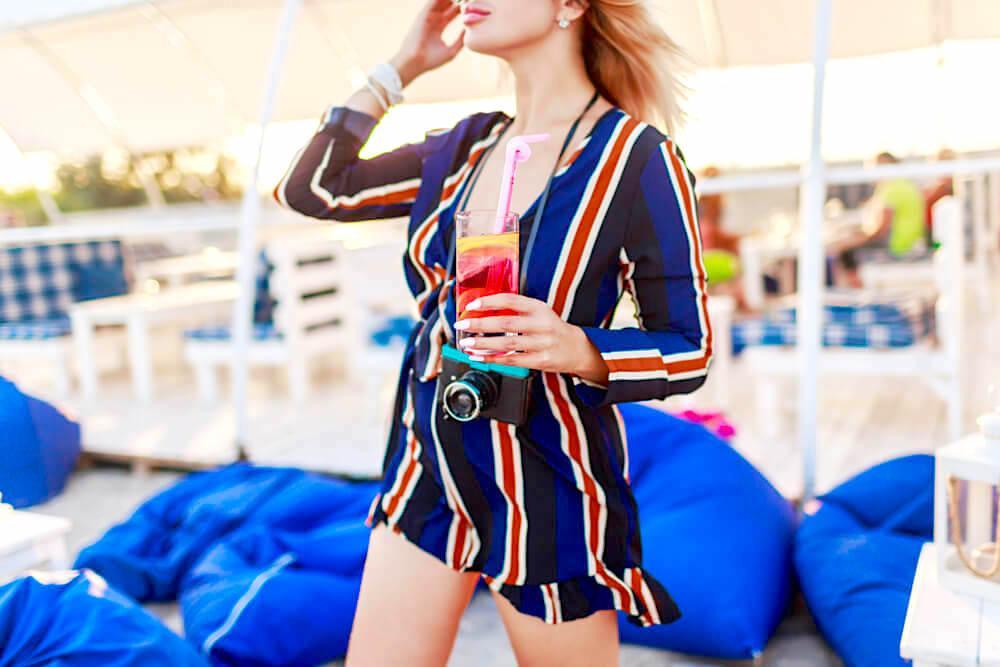 Young fashionable woman in striped rompers