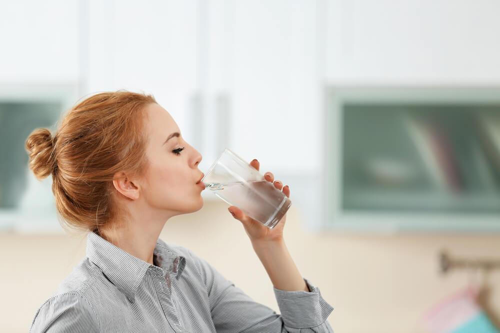 Woman drinking glass of water
