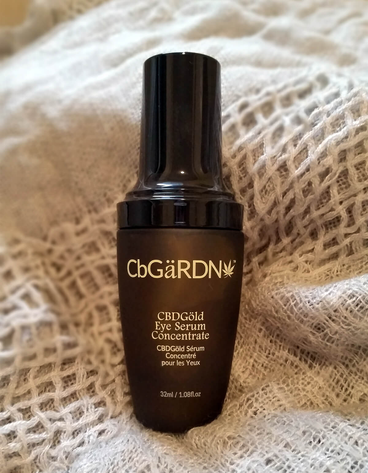 CBDGold Eye Serum Concentrate in bottle on blanket