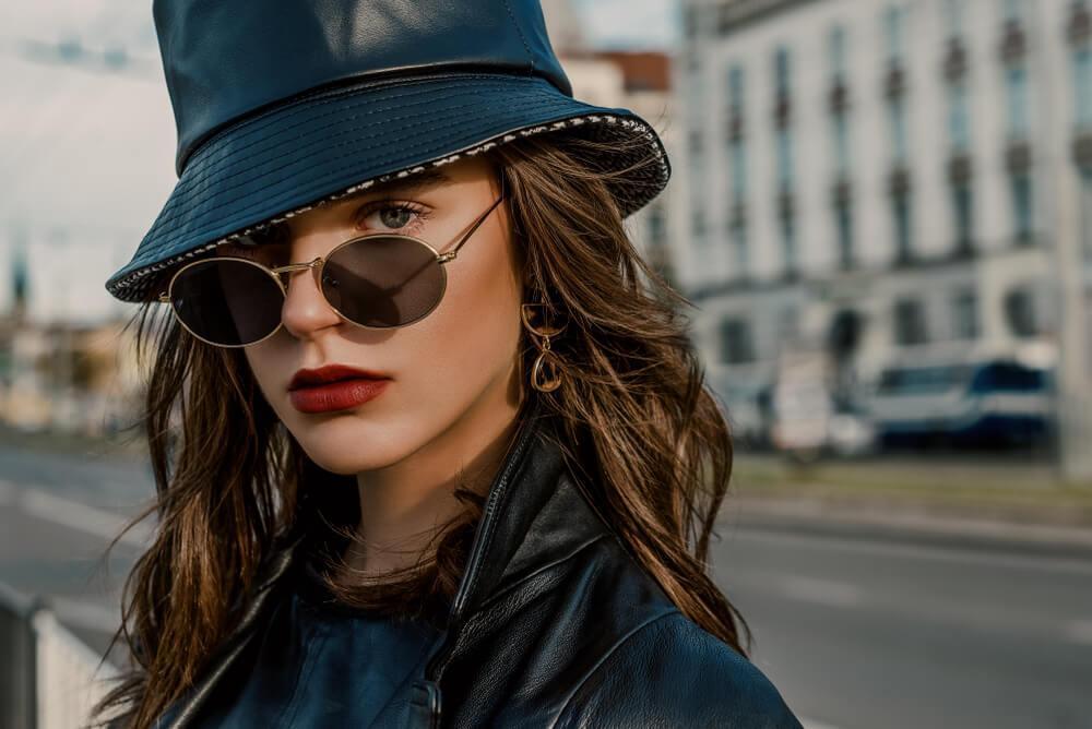 Woman wearing hat and sunglasses