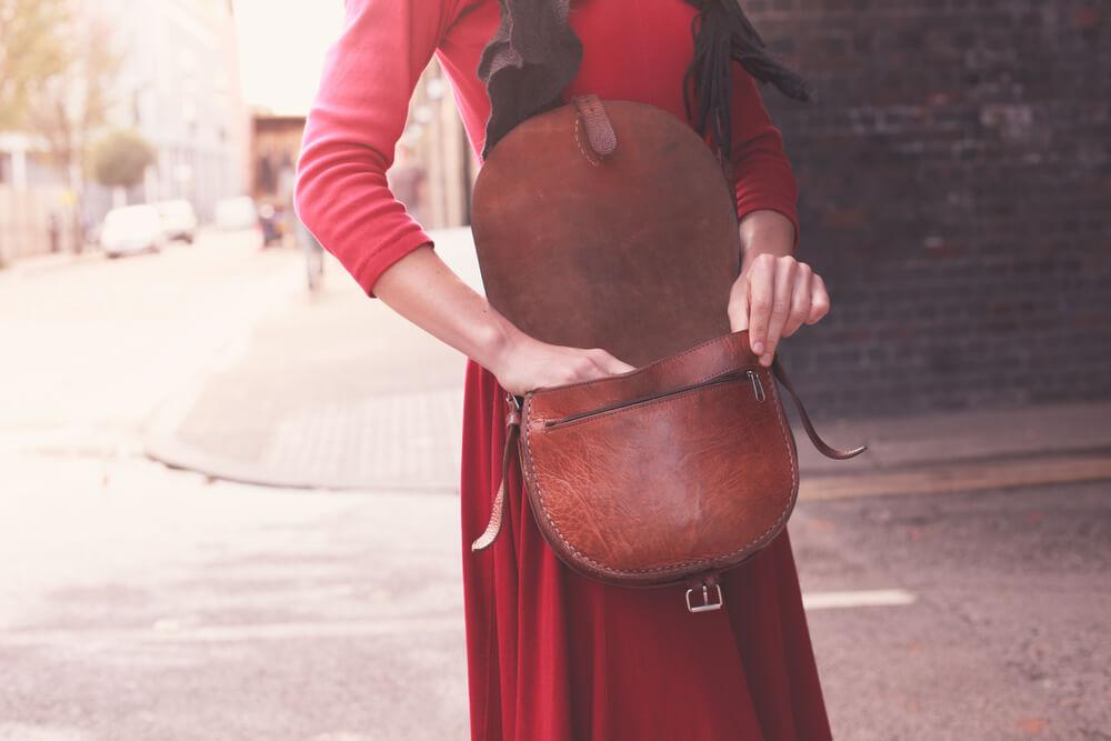 Woman with hand in purse