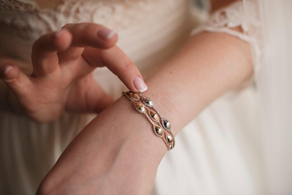 Woman touching bracelet on wrist