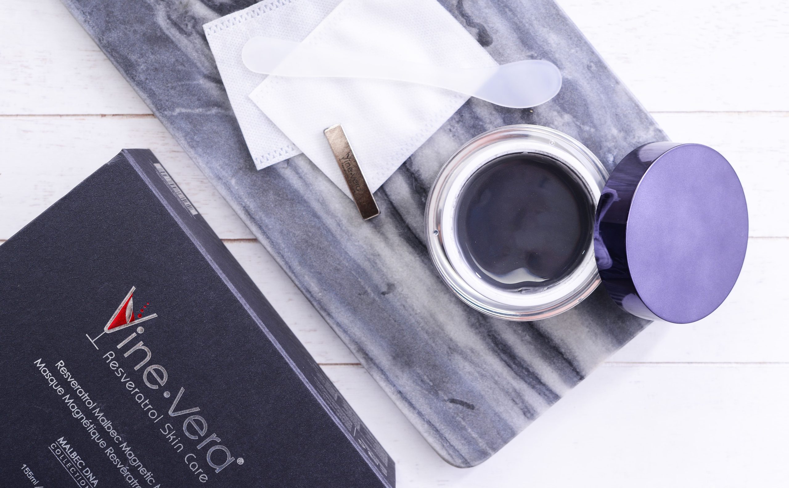 Open jar of Vine Vera magnetic mask